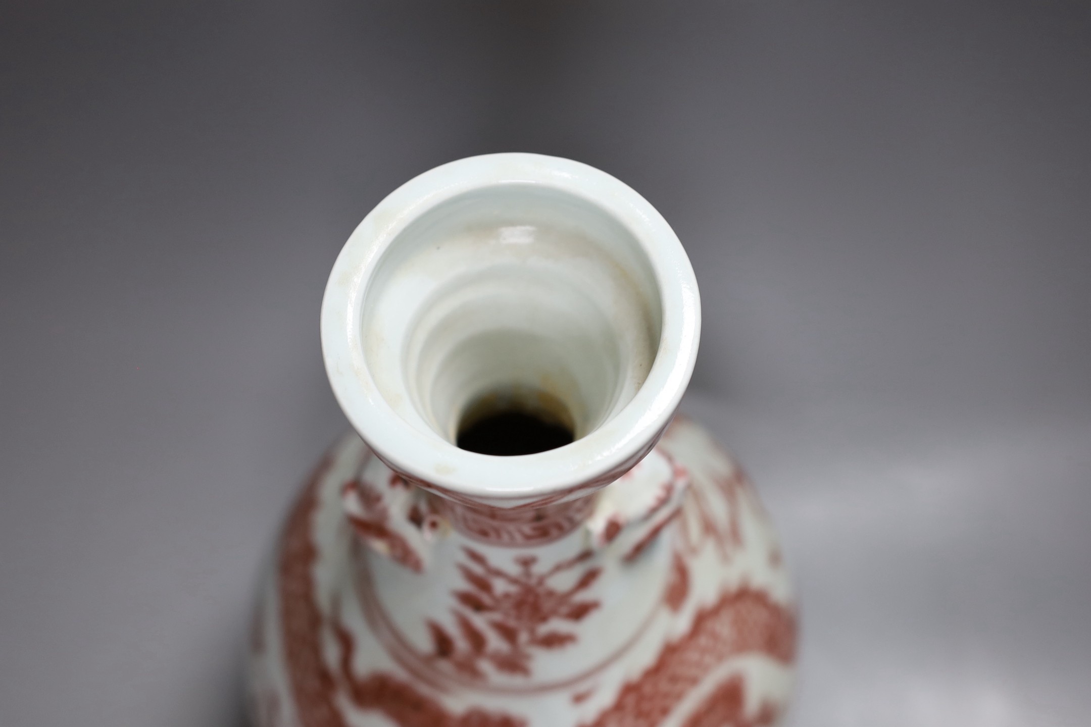 A Chinese vase with dragon decoration in underglaze copper, 35cm